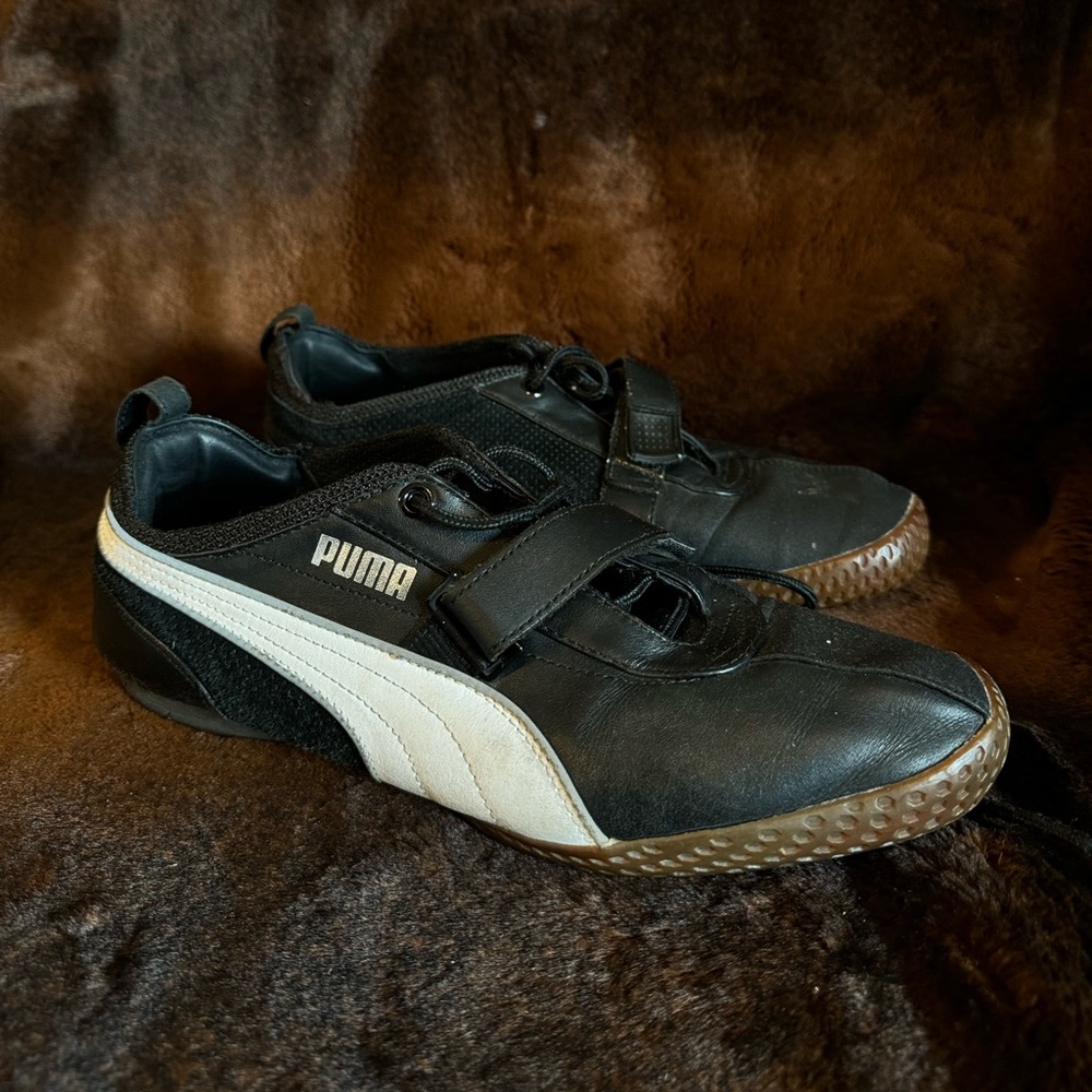 Size 10, black and white puma gym shoes rubber soles.